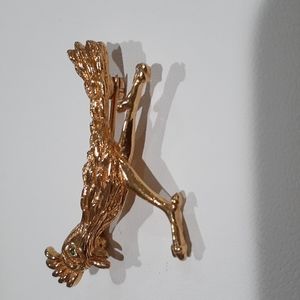Vintage DNH Goldtone Roadrunner with green glass eye